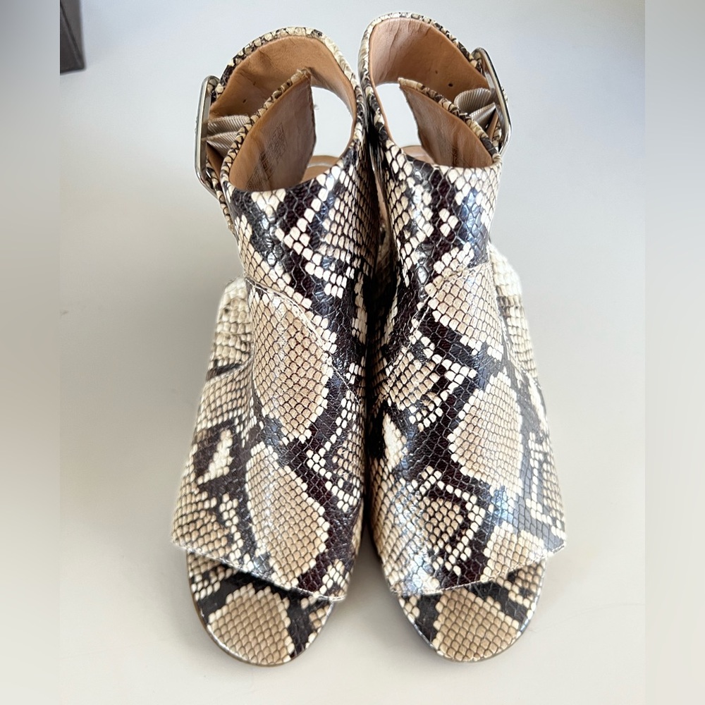 Woman’s snake skin open toe leather heeled bootie
